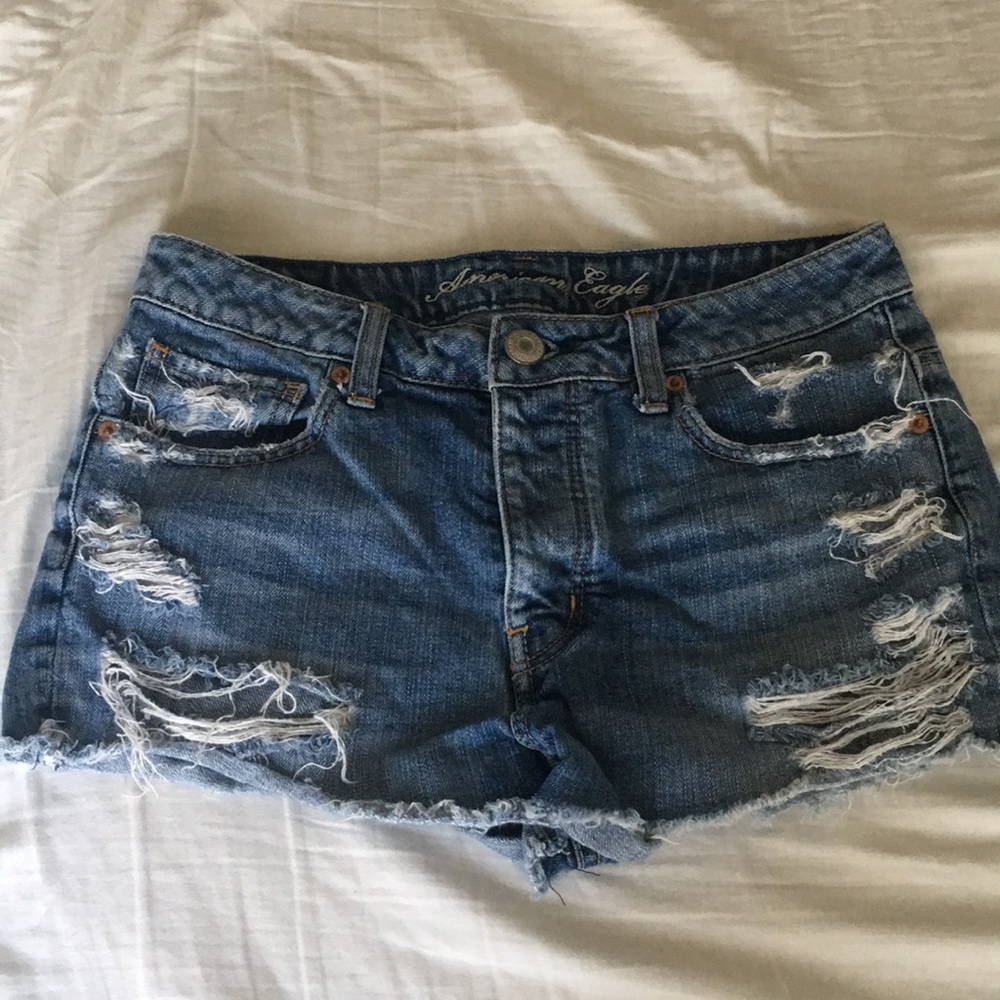 Ripped blue denim shorts